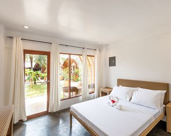 Tropical Temple Siargao Resort - ג'נרל לונה (סוריאגו דל נורטה) - חדר שינה