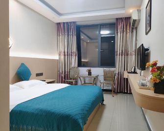 Shuangxin Business Hotel (Gaozhuang Starlight Night Market) - Xishuangbanna - Ložnice