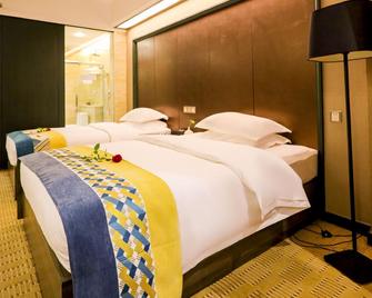 Eiffel Hotel - Xishuangbanna - Bedroom