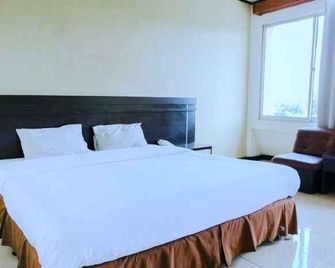 Bandung Permai Hotel Jember - Jember - Schlafzimmer