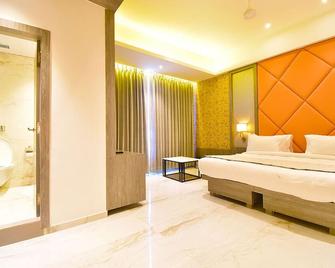 La Dhalia By Glitz Hotels - Thane - Спальня