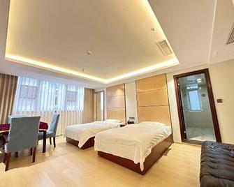 Enshi Xihe Business Hotel - Enshi - Habitación