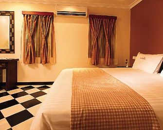 Meenakshi's Sunshine Hotel - Madurai - Habitación