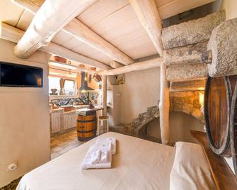 Monolocale con Vasca Idromassaggio Privata - Belgodere Apartments - Lacco Ameno - Camera da letto