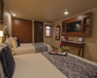 Arcángel Puebla - פואבלה - חדר שינה