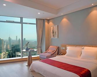 جراند ماديسن تشينجداو هاربر فيو سنترال - تشينغداو - غرفة نوم