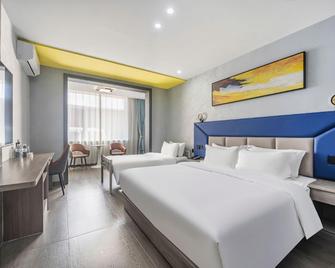 7Days Inn Tianjin Development Zone The Fifth Avenue Convention and Exhibition Center - Tianjin - Schlafzimmer