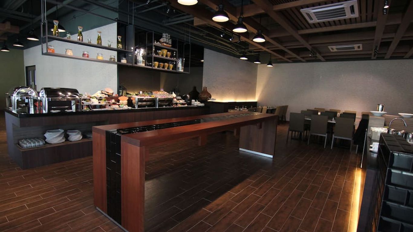 奈科斯商務套房酒店