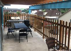 Covered parking/3 bedrooms, sitting room, restroom w/laundry, full kitchen, deck - Lead - Balcony