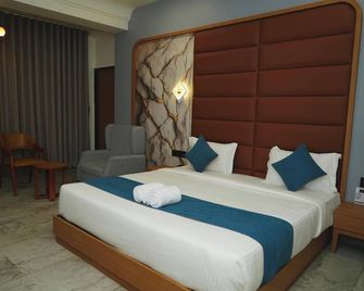 Hotel Leela's - Dwārka - Schlafzimmer