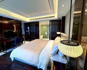 Aiport Apartment-stlye Hotel - Guiyang - Schlafzimmer