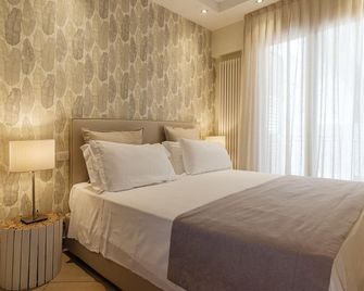 Residence Lungomare - Charming apartments - ريكسون - غرفة نوم