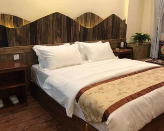 Xuanyuan Inn - Diqing - Bedroom
