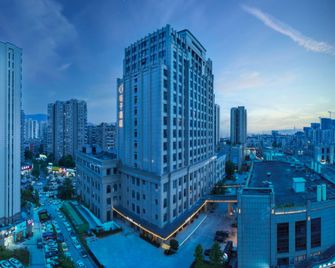 Orange Hotel Lishui Shuige - Lishui - Building