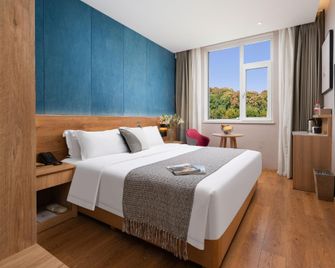 New Beacon Sunyee Spa Hotel - Wuhan - Makuuhuone