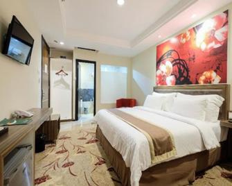 Travellers Hotel Phinisi - Makassar - Schlafzimmer