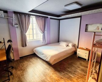 بيت ضيافة كيمشي بوسان داونتاون - بوسان - غرفة نوم