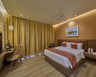 Grand Continent Mysore A Sarovar Portico Affiliate Hotel - Mysore - Slaapkamer