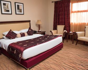 Crossroads Hotel - לילונגווה - חדר שינה