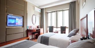 Greentree Inn Chizhou Qingyang Miaoqian Road Rongxing Building Business Hotel - Chizhou - Bedroom