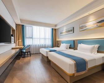 in Hotel (Xiangyang Erqi Store) - Ксіанфан - Спальня