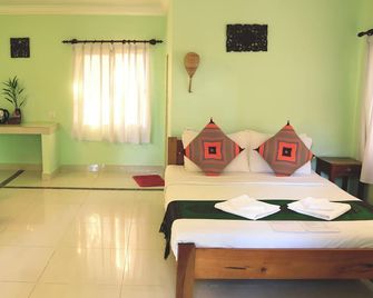 Bird of Paradise Bungalows - Kep - Schlafzimmer