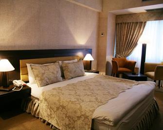 Le Grande Plaza Hotel - Taškent - Makuuhuone