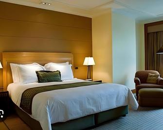 Hotel Rakshit International - Belgaum - Bedroom