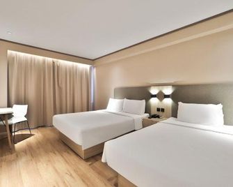 Hanting Hotel (Changchun Railway Station) - צ'נגצ'ון - חדר שינה