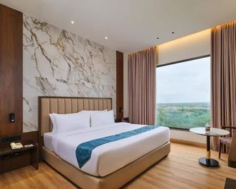 Regenta Central Shivani, Solapur - Solāpur - Slaapkamer