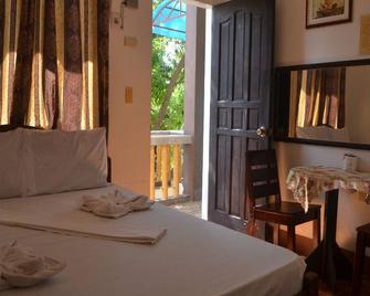 Island Home in Bantayan Island, with WiFi and AC - Nanette's Tourist Inn - Santa Fe - Bedroom