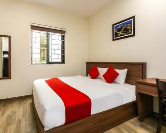 OYO 2010 Satria Guest House - Амбон - Спальня