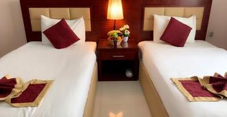 Hala Inn Hotel Apartments - Ajman - Yatak Odası
