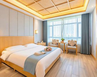 Jiuquan Ancient Road Inn Hotel (Wanda Plaza Branch) - Jiuquan - Slaapkamer