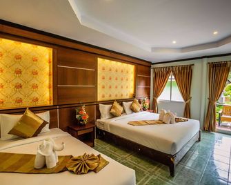 Phi Phi Andaman Beach Resort - קופיפי - חדר שינה