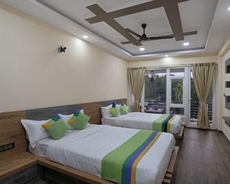 Treebo Sky Vista Suites with Hill View - Chikmagalur - Schlafzimmer