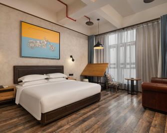 Dada Wooden Horse Hotel (Chongqing Guanyinqiao Metro Station Branch) - Chongqing - Bedroom