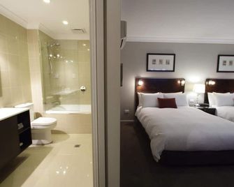 Carlyle Suites and Apartments - ווגה ווגה - חדר שינה