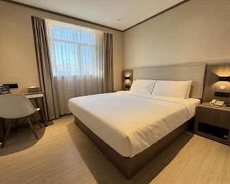 Hanting Hotel Tianjin Jinnan Development Zone National Exhibition Center - Tianjin - Bedroom