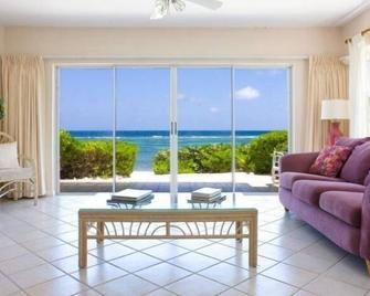 Gorgeous Detached Sandy Beachfront Villa at Azure Breeze Villas. - North Side - Living room
