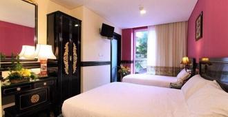 โรงแรมเลอ เพอรานากัน - สิงคโปร์ - ห้องนอน