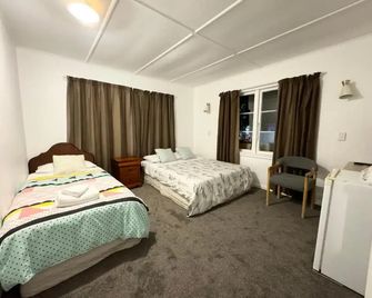 Rainbow Motel & Guest House - טאורנגה - חדר שינה