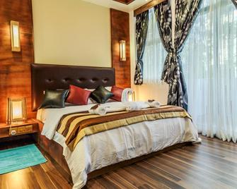 Eureka Airport Inn - Malé - Schlafzimmer