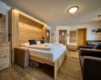 Delfi Ski & Bike Apartments - Saalbach - Schlafzimmer