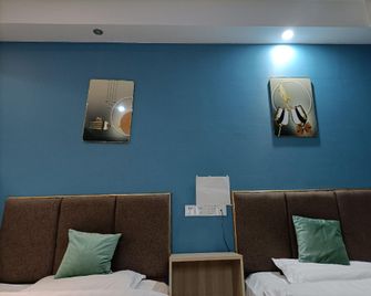 OYO Deyang City Home Xianghe Hotel - Deyang - Bedroom