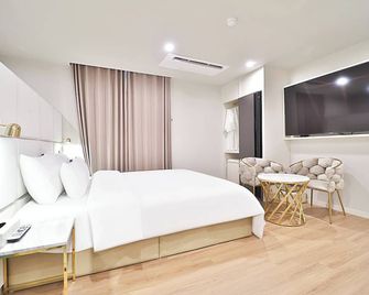 Den Basta Hotel Hadan - Pusan - Sovrum