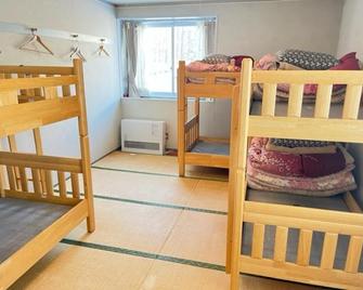 Kusatsu Kogen Youth Hostel - Kusatsu - Phòng ngủ