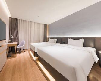 Huiting International Hotel (Harbin Railway Station Airport Bus Station Branch) - Harbin - Habitación