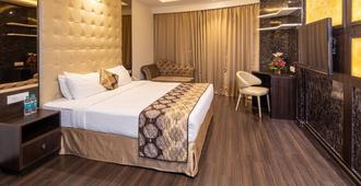 Goldfinch Hotel Mangalore - Mangalore - Slaapkamer