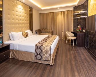 Goldfinch Hotel Mangalore - Mangalore - Habitación